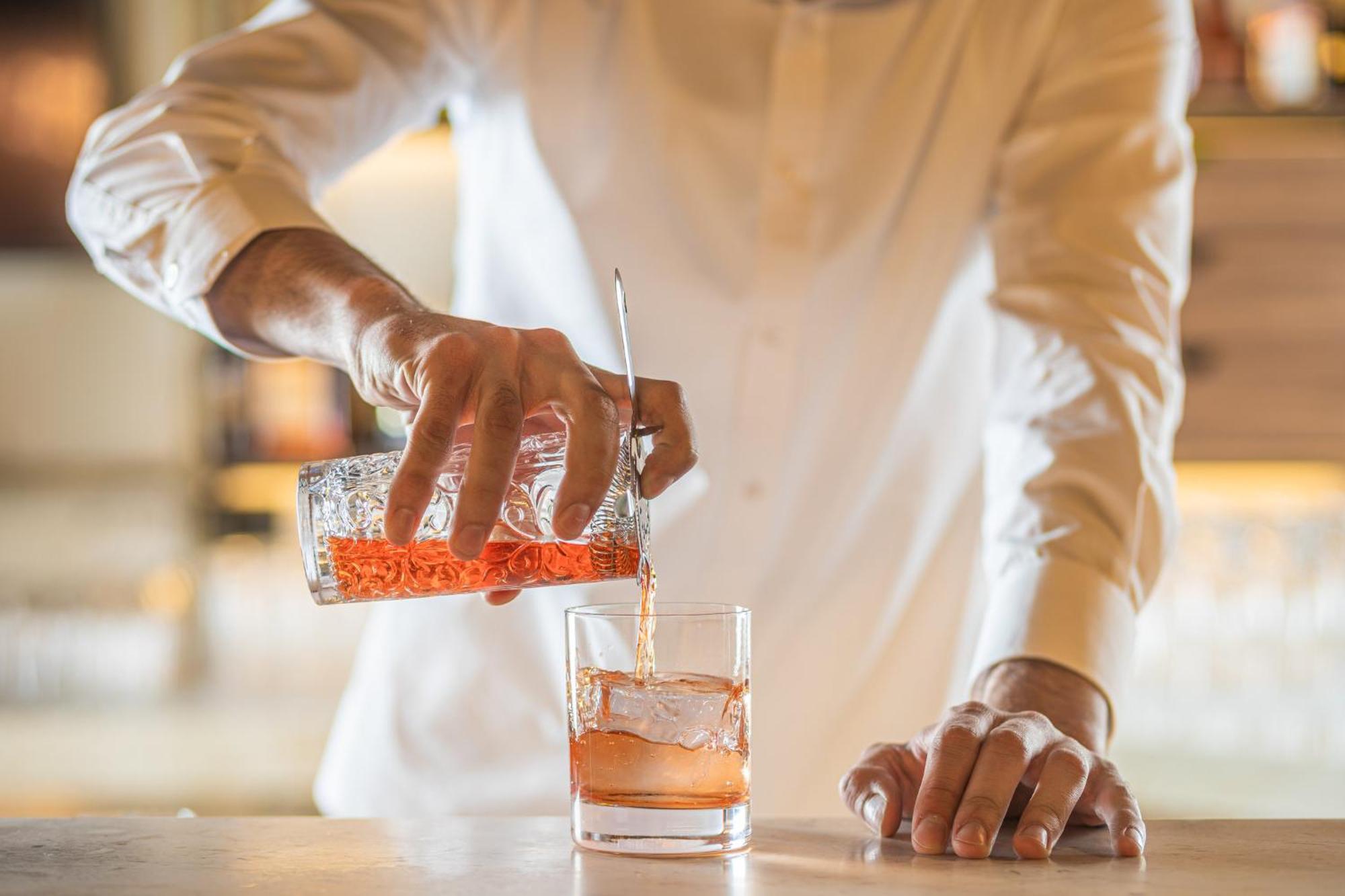 Viceroy Kopaonik Serbia Dış mekan fotoğraf A bartender stirring a cocktail